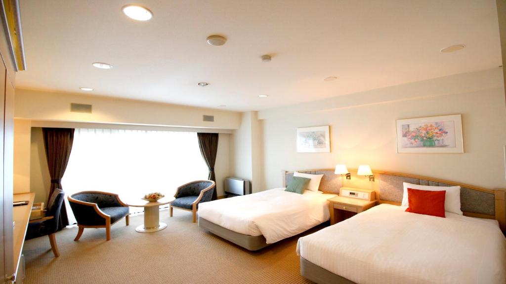 Postel nebo postele na pokoji v ubytování Hotel Cypress Karuizawa