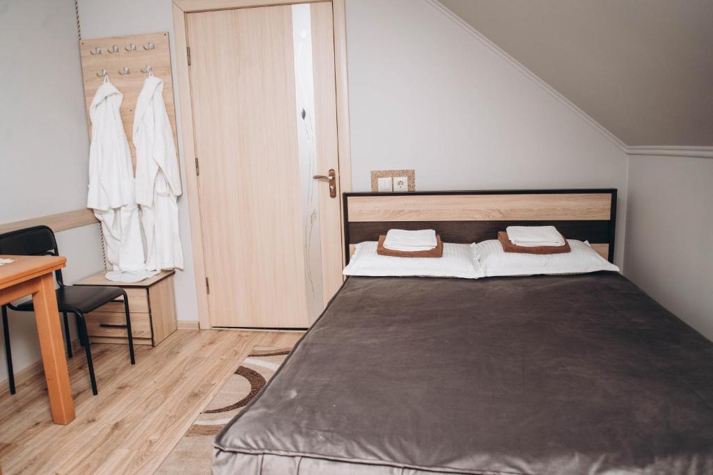 Postel nebo postele na pokoji v ubytování Hotel VIZA & SPA