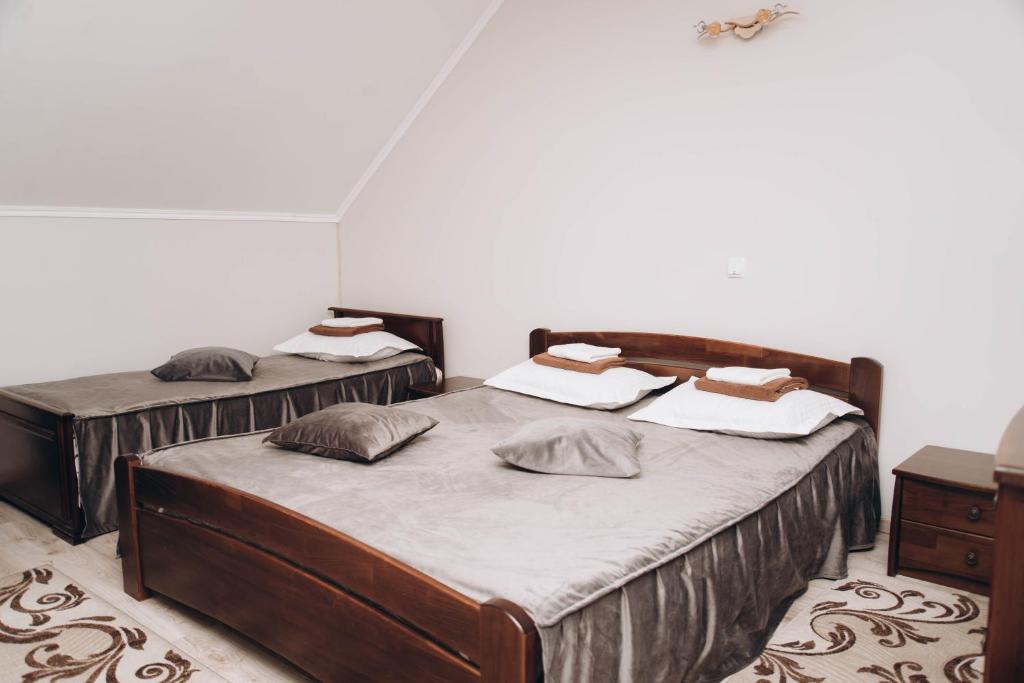 Postel nebo postele na pokoji v ubytování Hotel VIZA & SPA