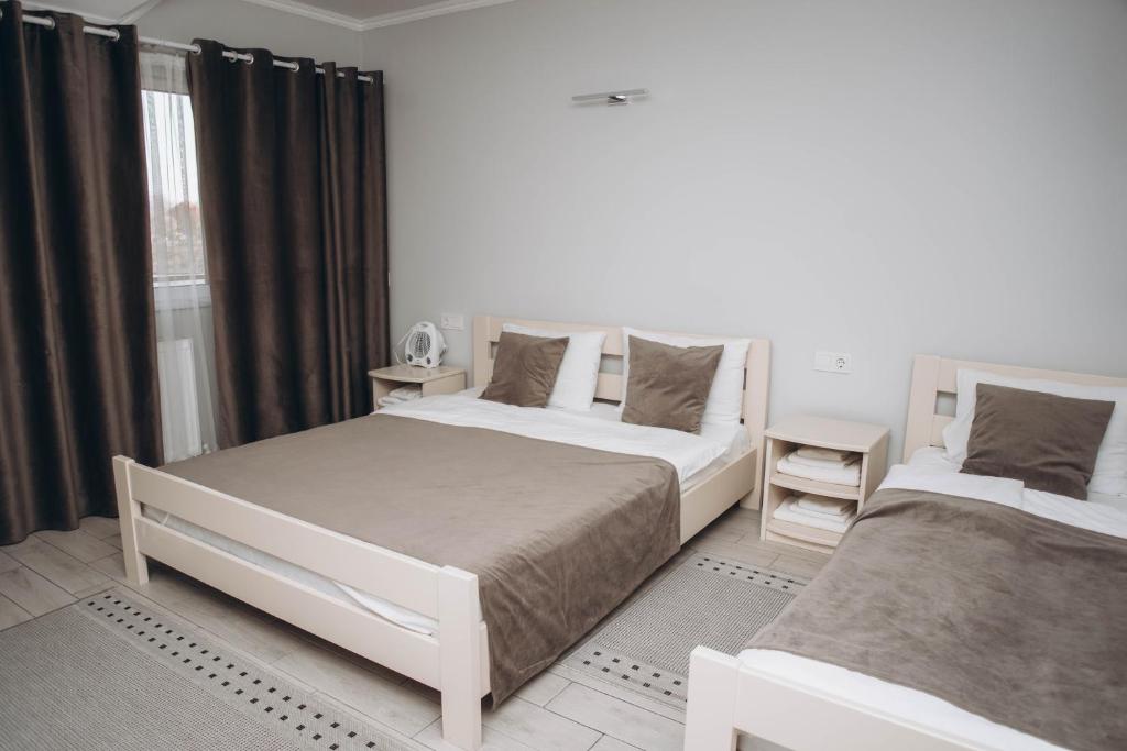 Postel nebo postele na pokoji v ubytování Hotel VIZA & SPA