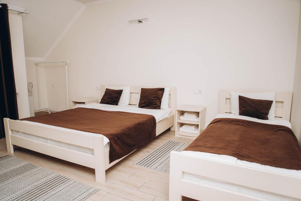 Postel nebo postele na pokoji v ubytování Hotel VIZA & SPA