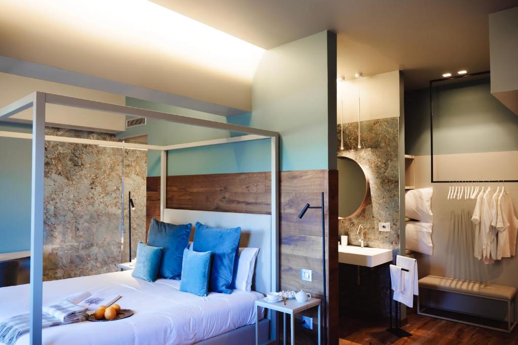 Postel nebo postele na pokoji v ubytování Albergo La Pace