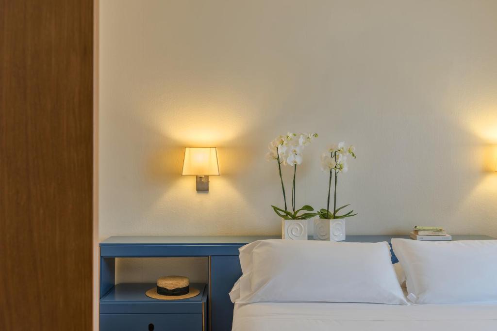 Postel nebo postele na pokoji v ubytování Albergo La Pace