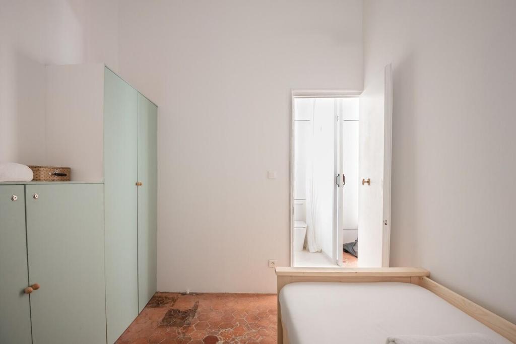 a bedroom with a bed and a mirror at |Aaa|- Pure &amp; Natural Massilia City Center in Marseille
