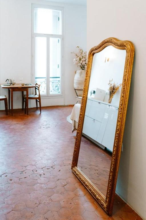 a mirror sitting on the floor in a room at |Aaa|- Pure &amp; Natural Massilia City Center in Marseille