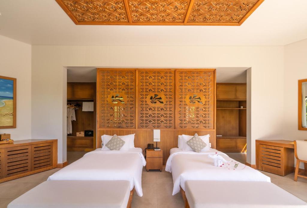 Postel nebo postele na pokoji v ubytování The Shells Resort & Spa Phu Quoc
