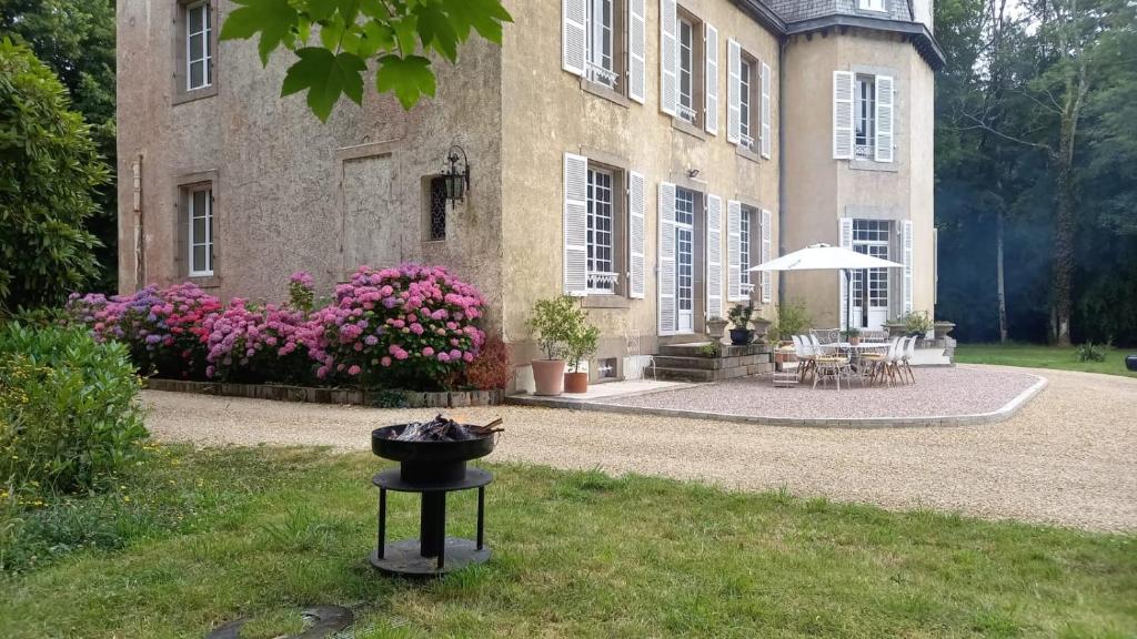 a house with a grill in front of it at LA LANDE in Pleyber-Christ