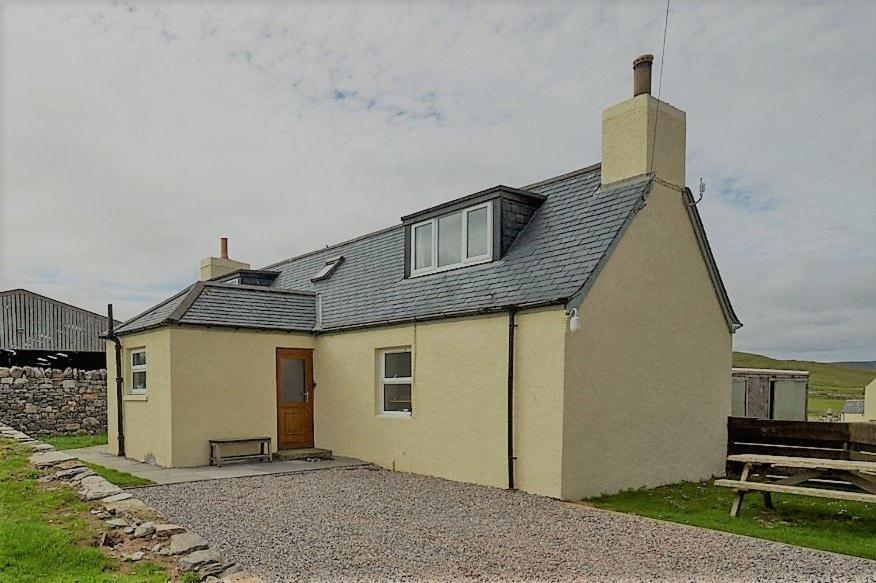 a small house with a window on top of it at Balnakeil Cattleman's Bothy in Durness