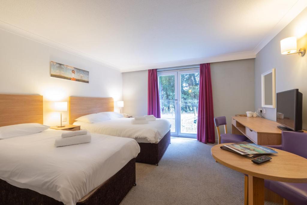 The Broadway Park Hotelにあるベッド