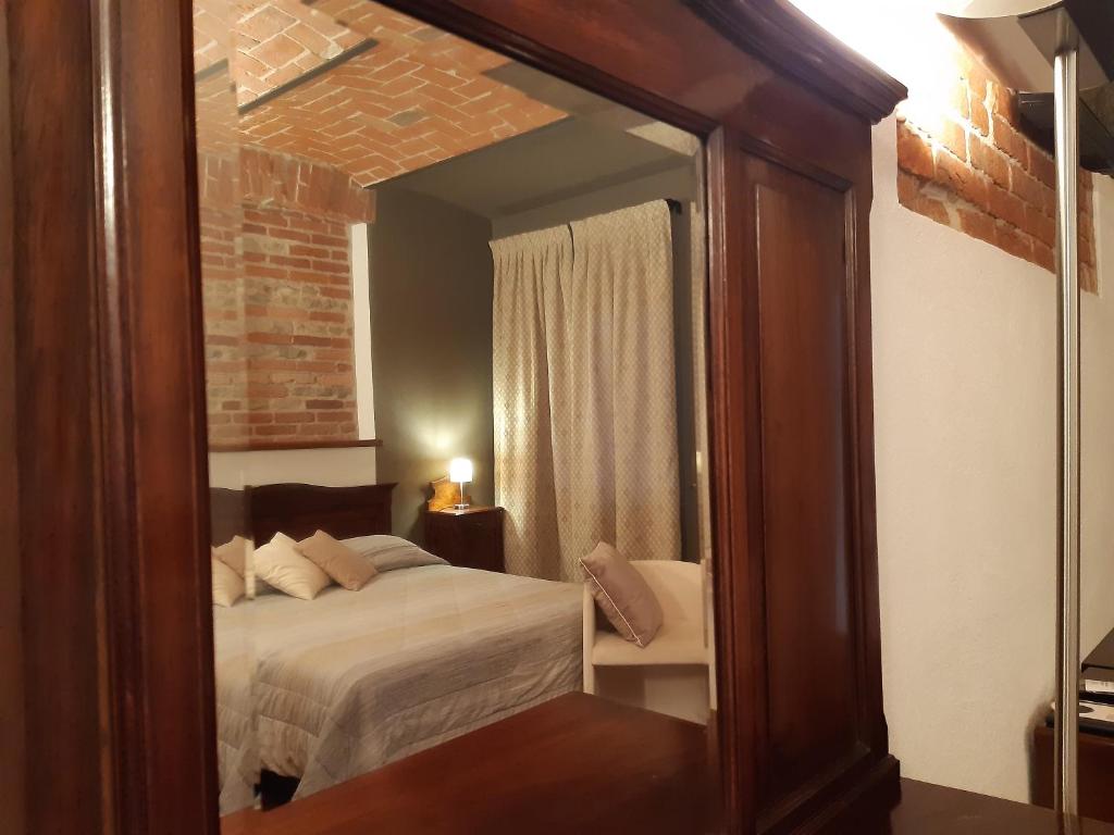 Postel nebo postele na pokoji v ubytování Red Wine Camere