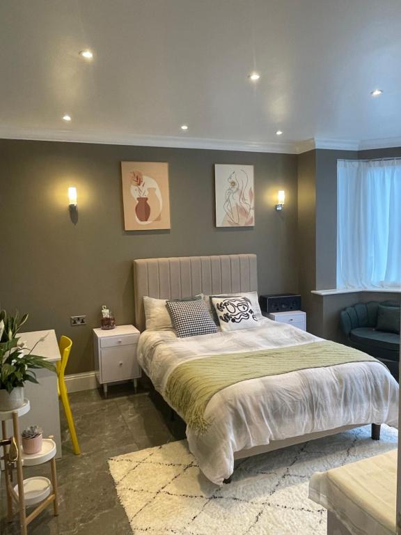 a bedroom with a large bed in a room at Modern huge double room with private bathroom in Colindale in Colindale