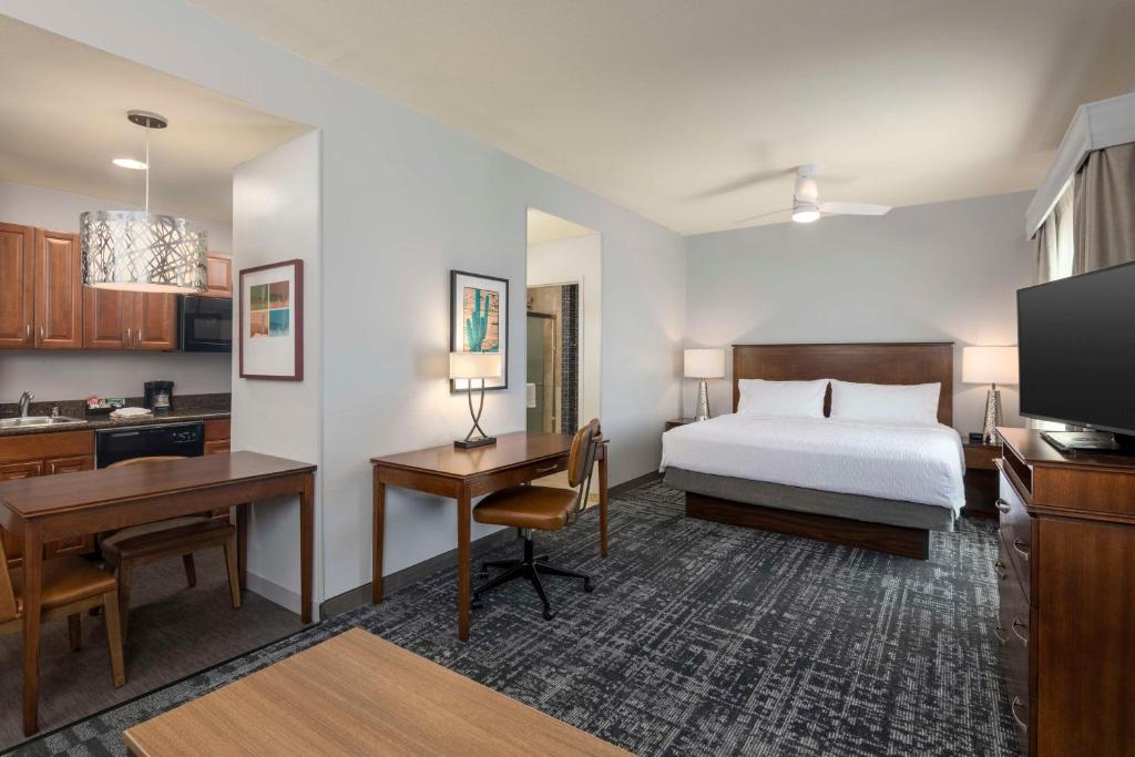 a hotel room with a bed and a desk at Homewood Suites by Hilton Phoenix North-Happy Valley in Phoenix