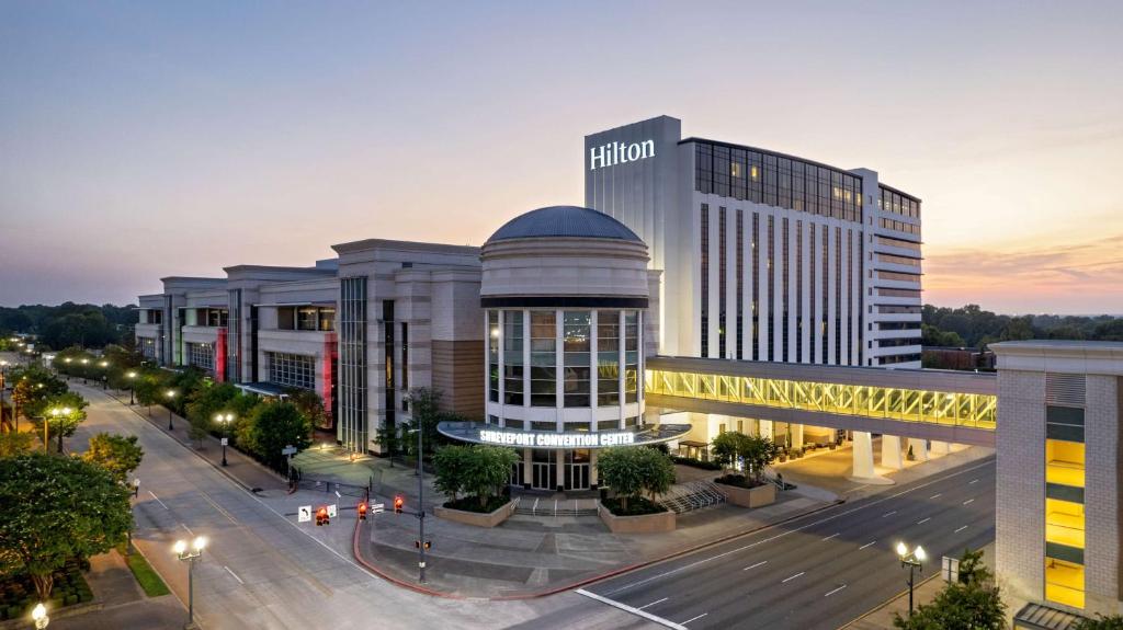a large building in a city with a street at Hilton Shreveport in Shreveport