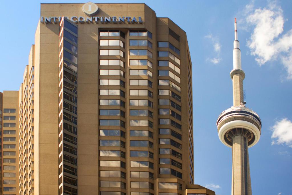 a building with the cn tower in the background at InterContinental Toronto Centre, an IHG Hotel in Toronto