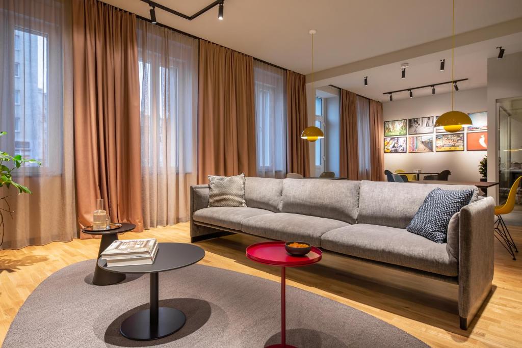 a living room with a couch and two tables at ipartment Berlin Mitte in Berlin