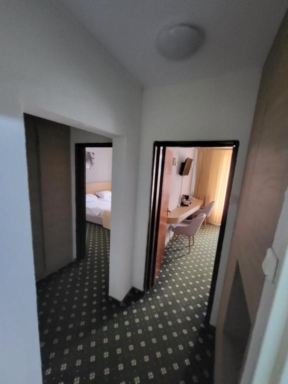 Postel nebo postele na pokoji v ubytování Hotel Padis