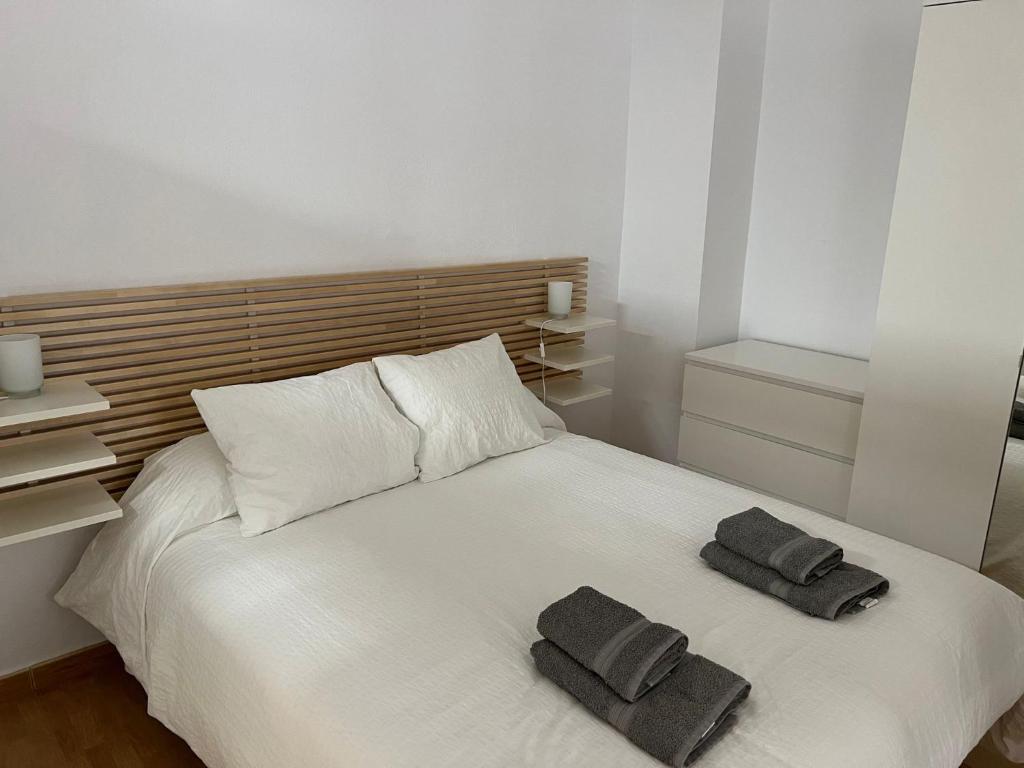 Ένα ή περισσότερα κρεβάτια σε δωμάτιο στο Aracena Cozy Hideaway
