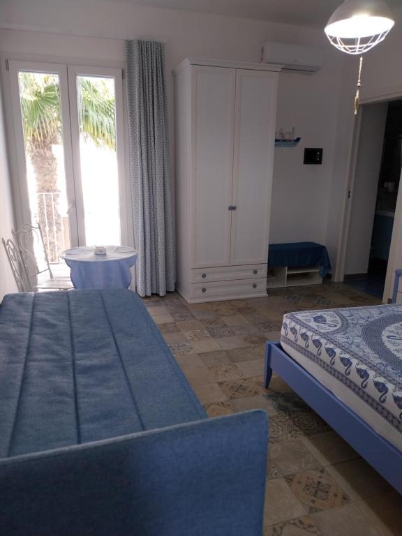 A bed or beds in a room at B&B LA COLIMENA