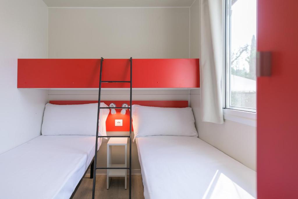 Postel nebo postele na pokoji v ubytování Camping Fontanelle