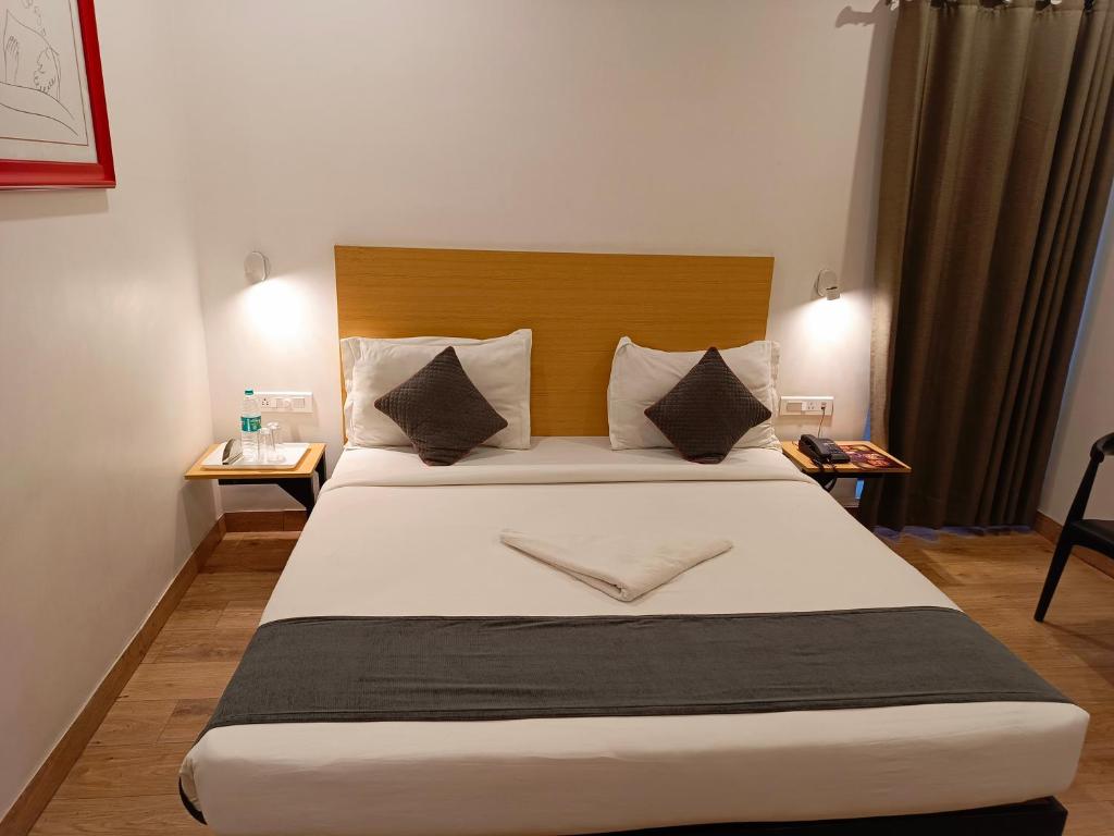 Postel nebo postele na pokoji v ubytování SM Hives Business Hotel