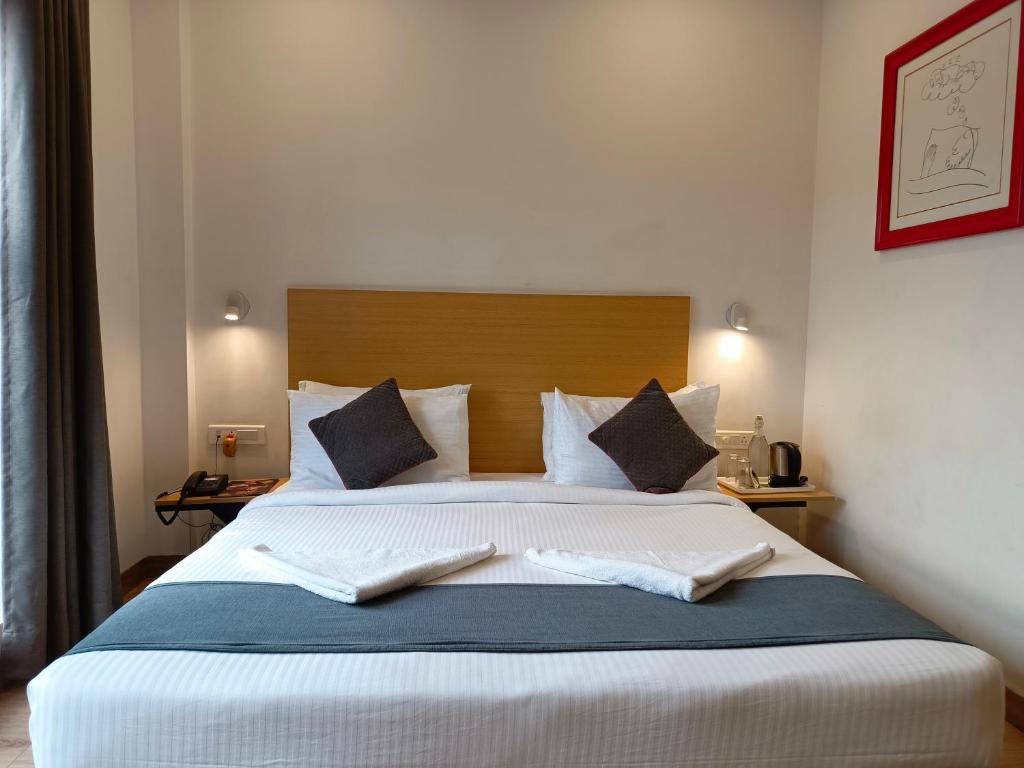 Postel nebo postele na pokoji v ubytování SM Hives Business Hotel