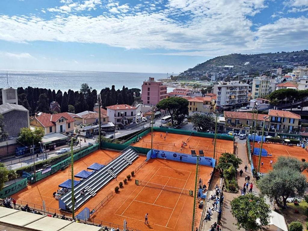 an overhead view of a tennis court in a city at Matchpoint Apartment in Sanremo