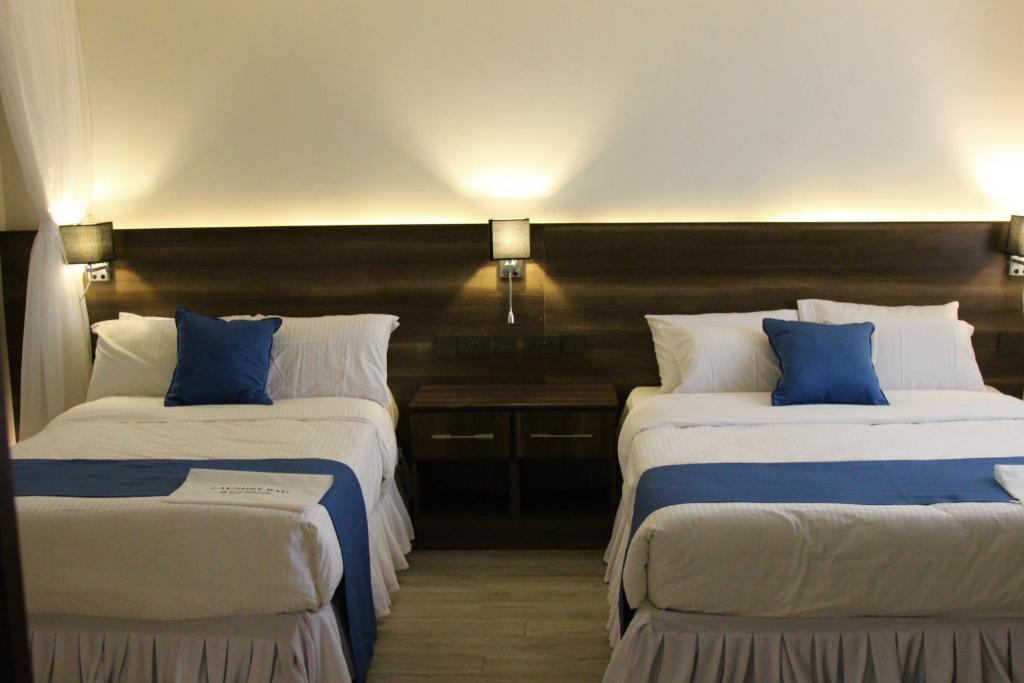 Postel nebo postele na pokoji v ubytování Lukenya Alkebu Resort