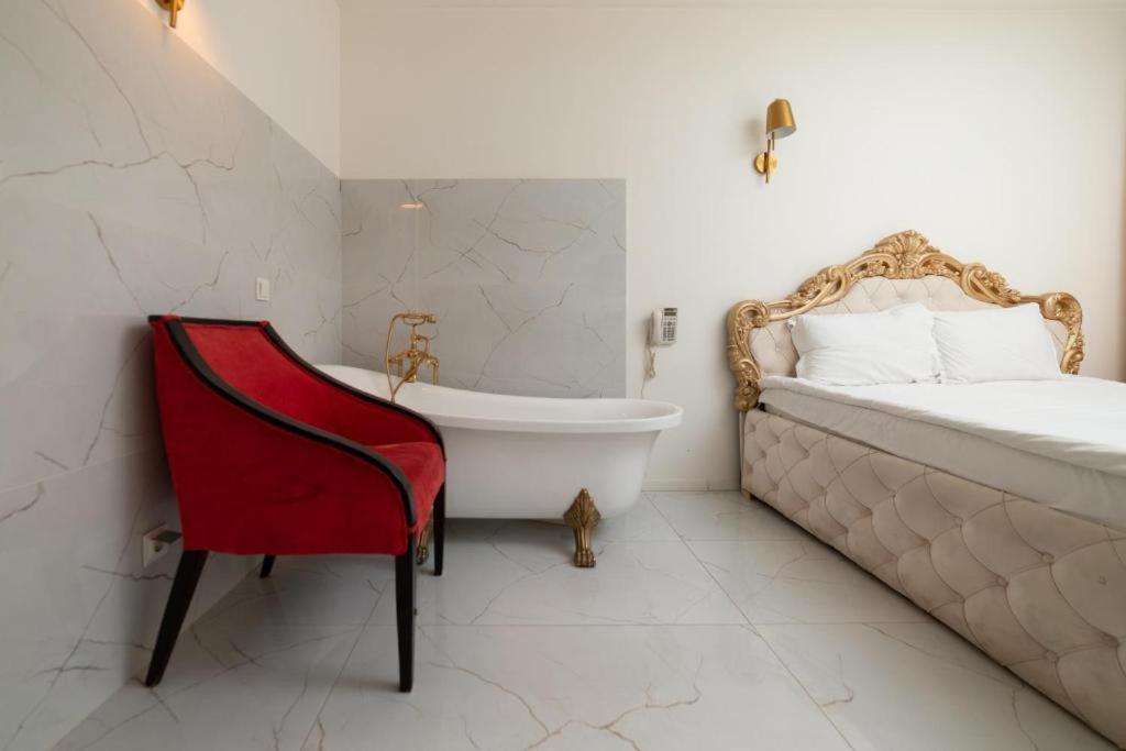 Postel nebo postele na pokoji v ubytování Hotel Gloria KS