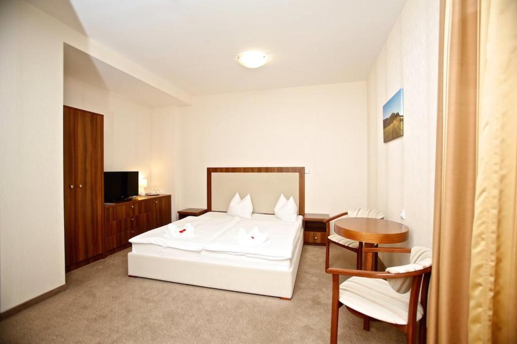 Postel nebo postele na pokoji v ubytování Hotel Arman