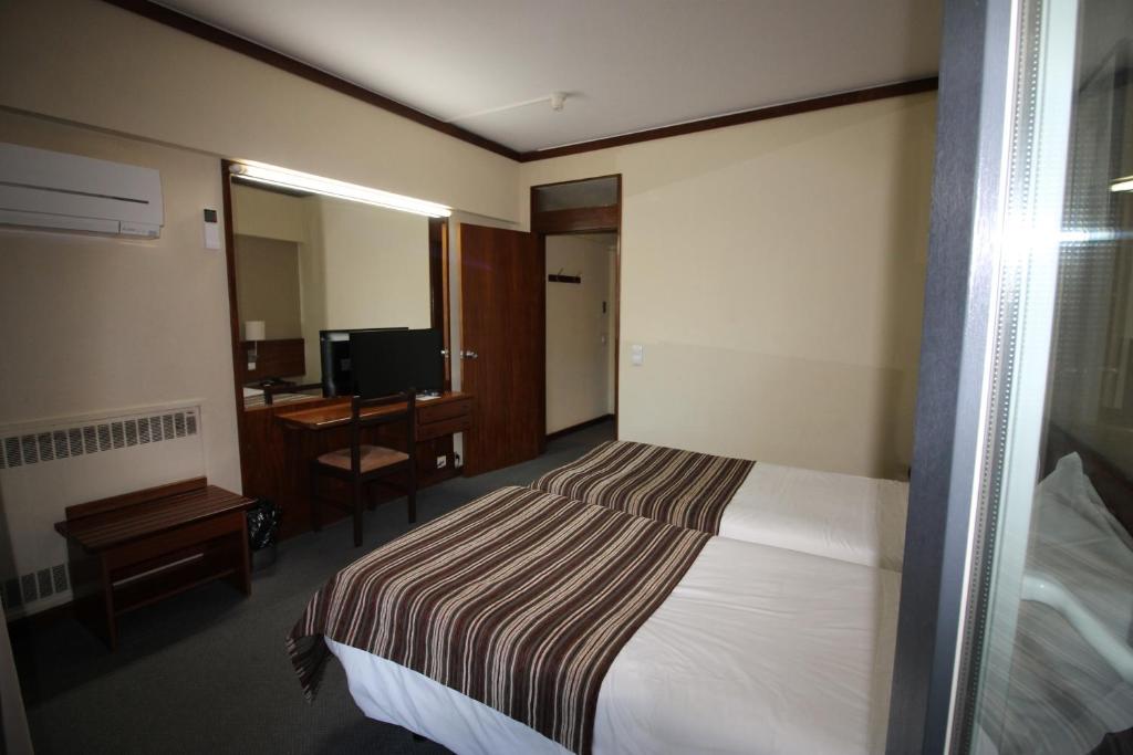 Uma cama ou camas num quarto em Hotel Senhora do Castelo