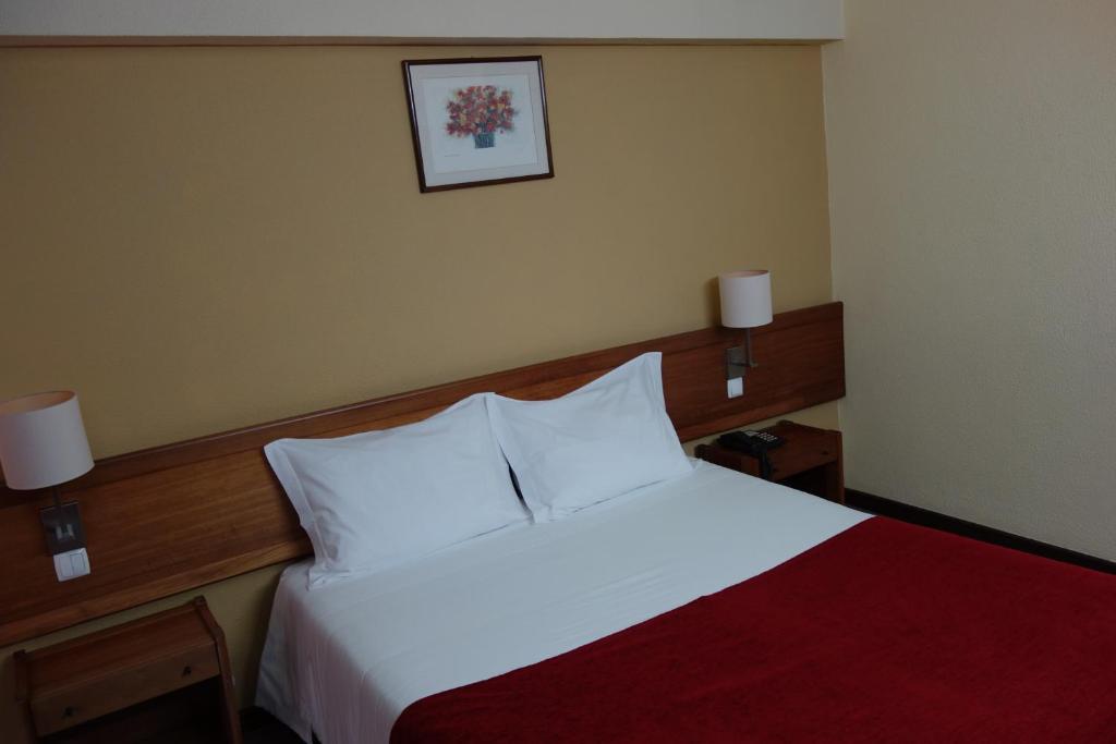 Uma cama ou camas num quarto em Hotel Senhora do Castelo