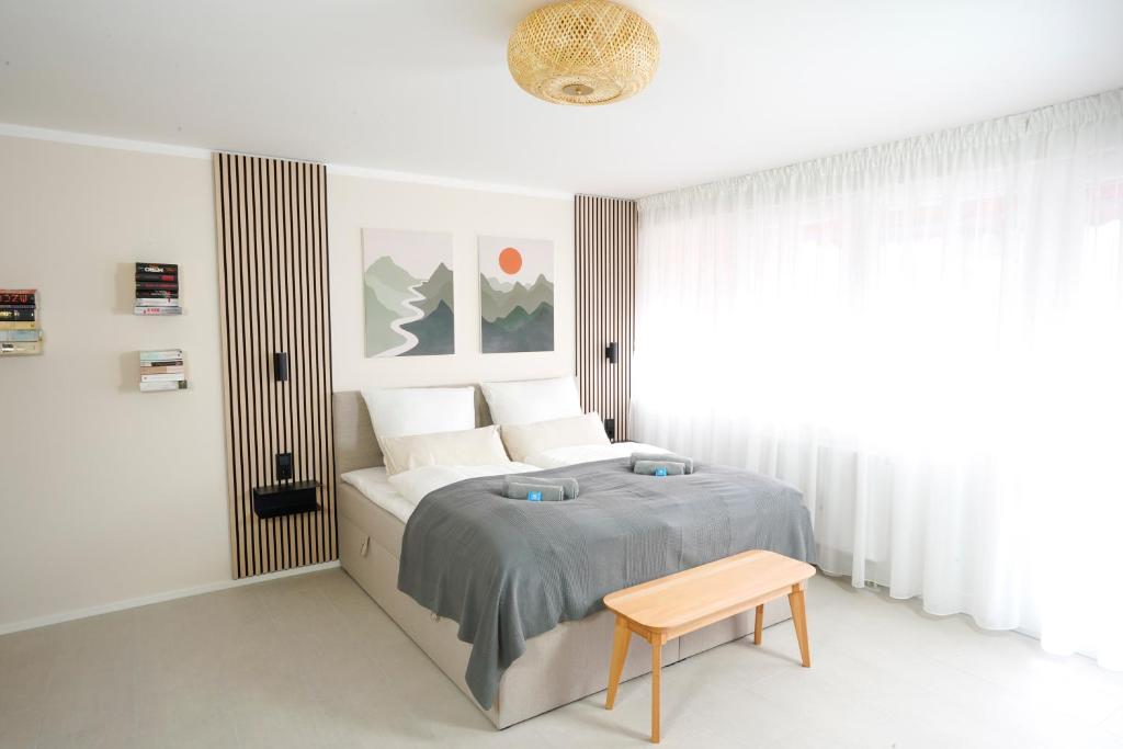 a bedroom with a bed and a table at Kur-Apartment Matilda in Waldbronn