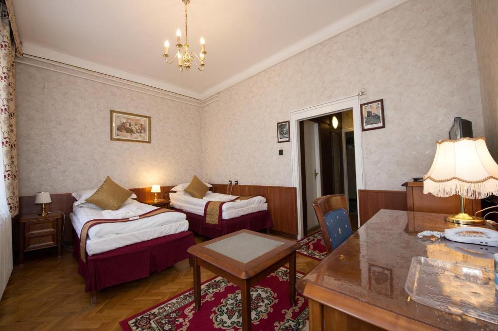 Postel nebo postele na pokoji v ubytování Hotel Tisza és Thermálfürdő
