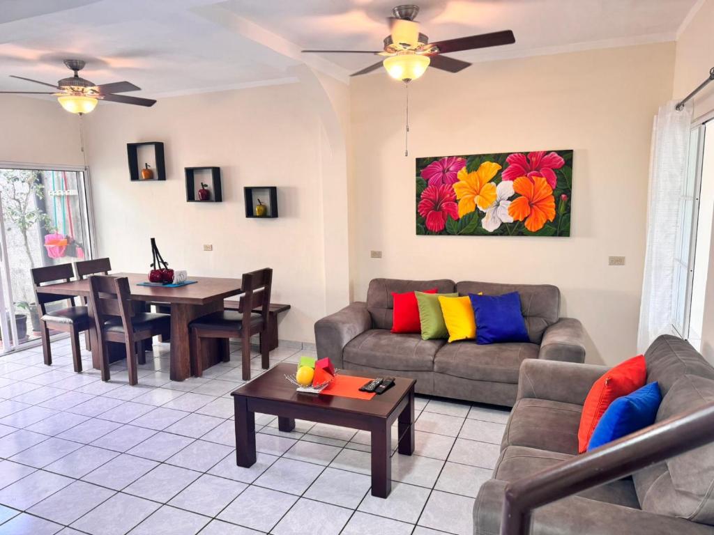 a living room with a couch and a table at Chalchuapa, Santa Ana La Casa de Sussy, El Salvador in Chalchuapa