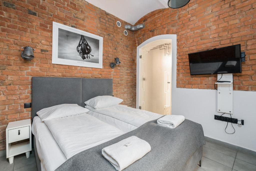 Ліжко або ліжка в номері Strzalowa Underground Level Apartments by Renters