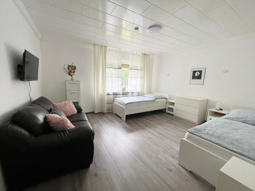 Ένα ή περισσότερα κρεβάτια σε δωμάτιο στο Work & Stay in Siegburg