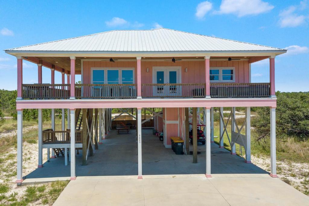 a house on the beach with a gazebo at Ocean Overlook in Gulf Shores