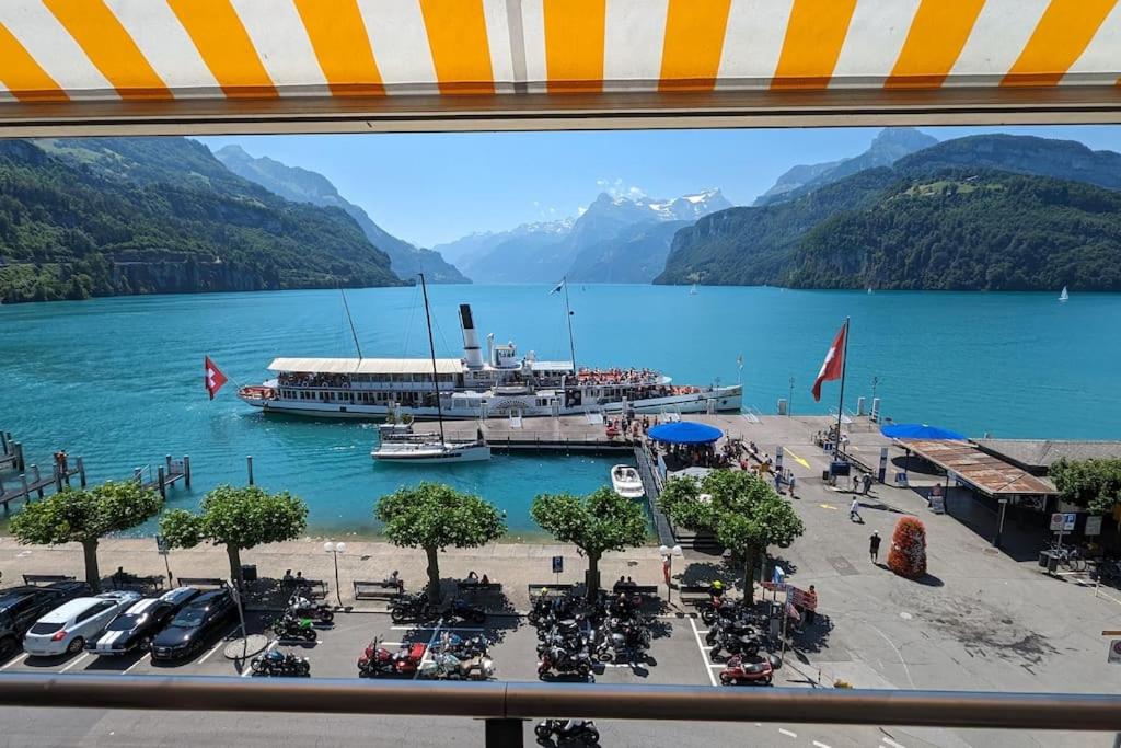 a view from a window of a marina on a lake at Lake Lucerne Paradise apartment in Brunnen