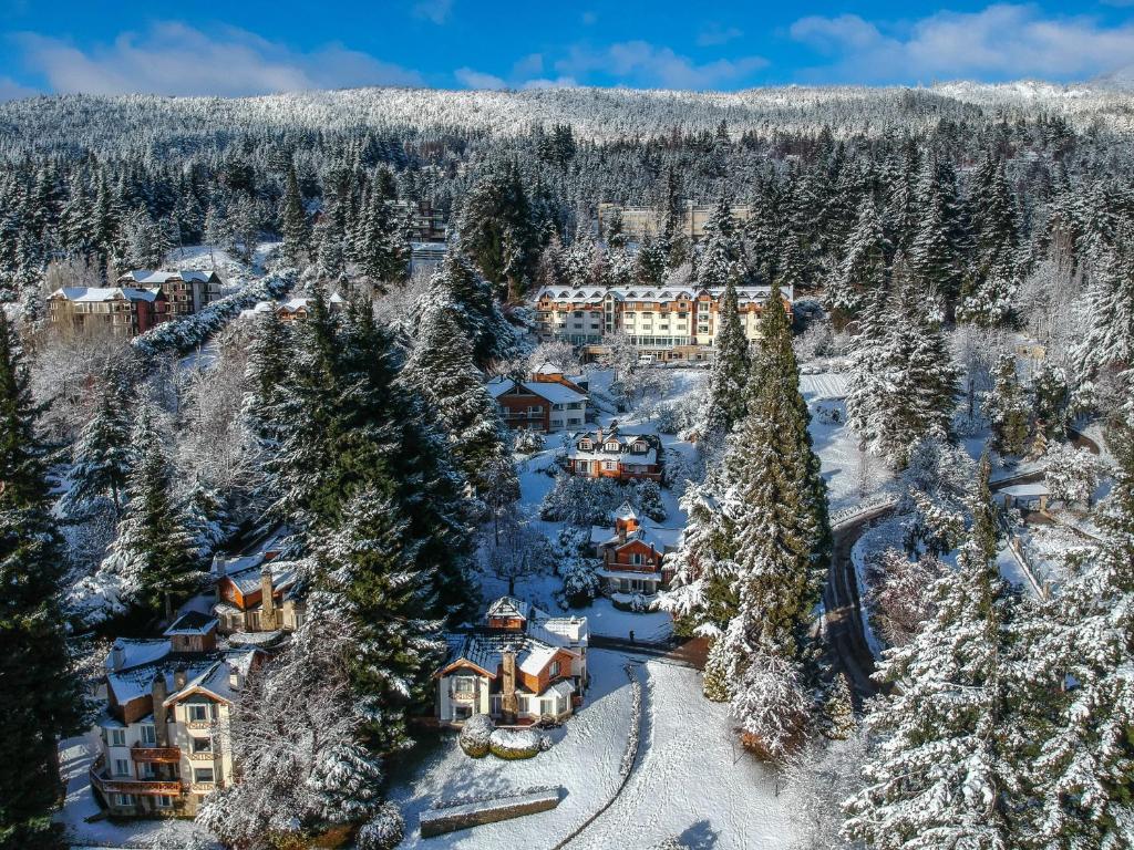 an aerial view of a resort in the snow at Huinid Bustillo Cabañas in San Carlos de Bariloche