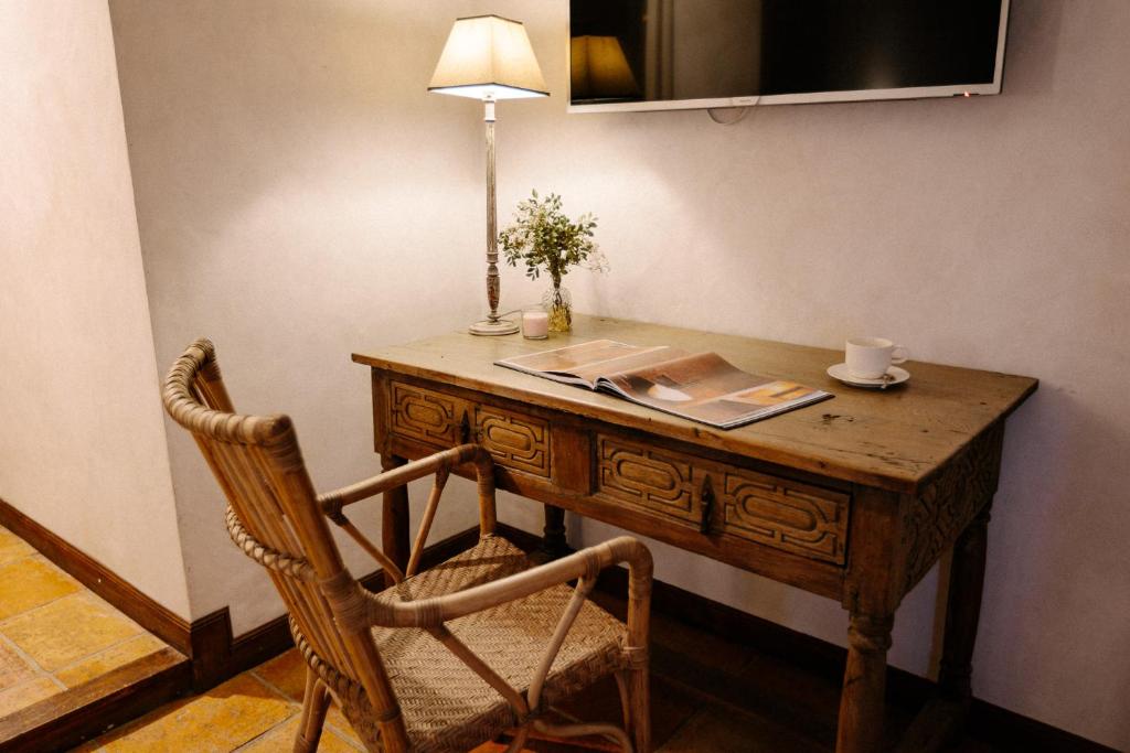 TV a/nebo společenská místnost v ubytování Hotel Finca El Peregrino