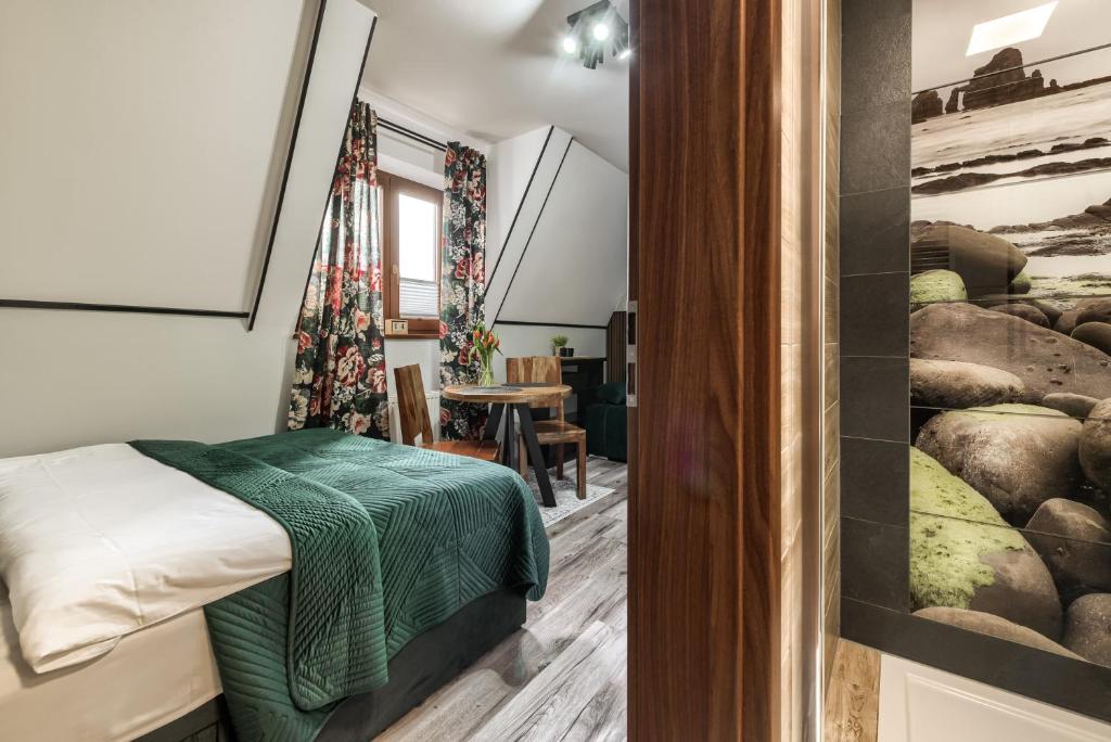 Posteľ alebo postele v izbe v ubytovaní Przytulia Apartamenty i Pokoje