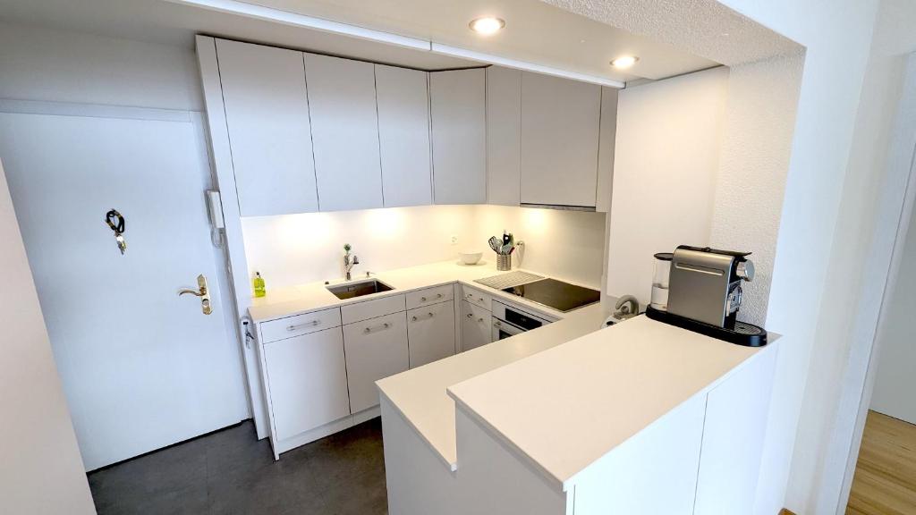 Kuchyň nebo kuchyňský kout v ubytování Lake Lucerne Paradise Apartment
