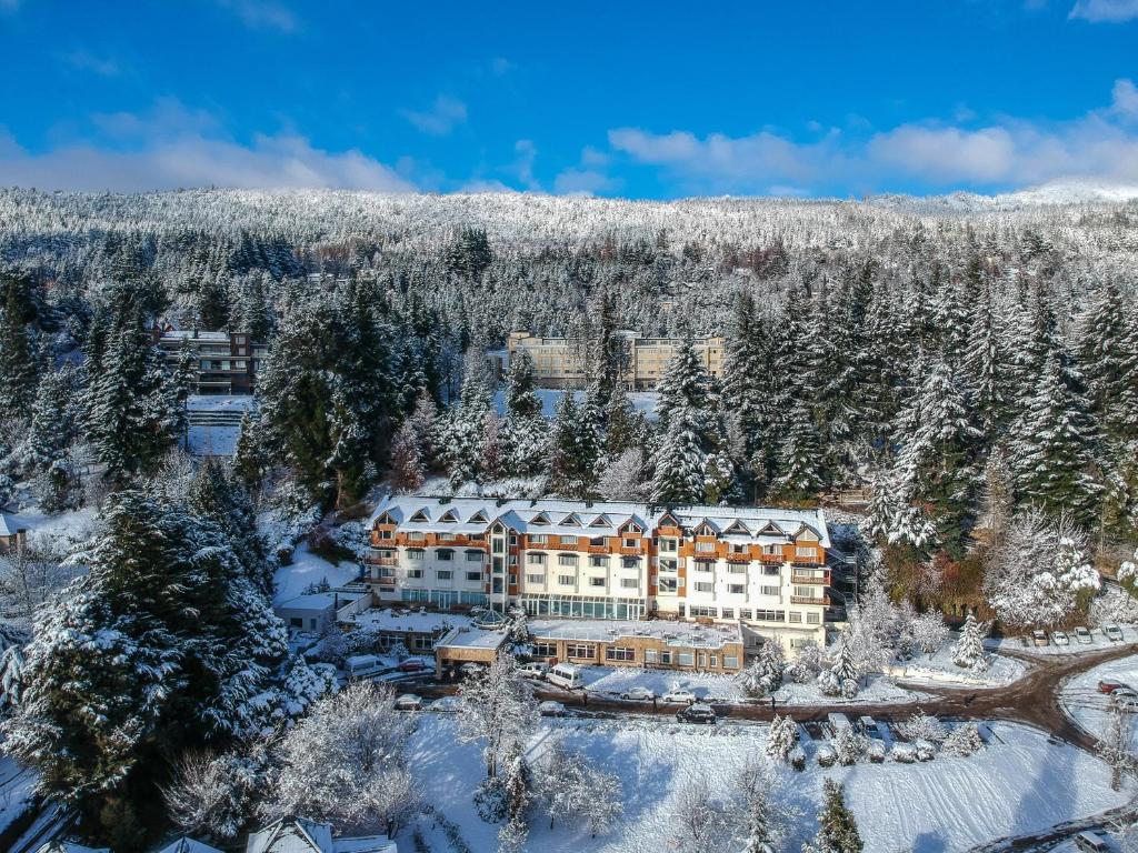 an aerial view of a resort in the snow at Huinid Bustillo Hotel & Spa in San Carlos de Bariloche