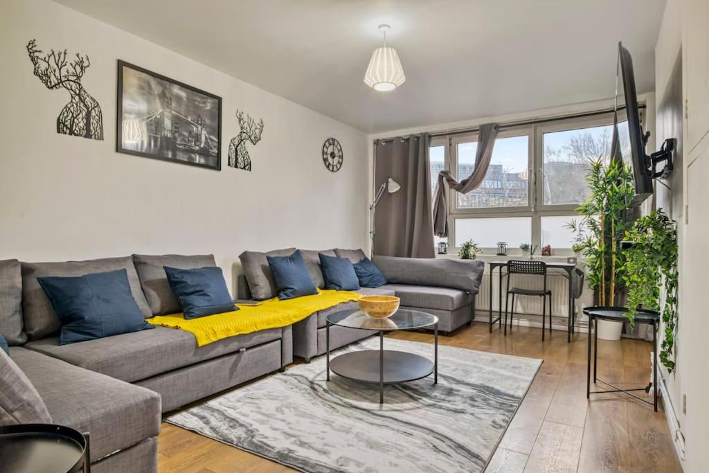 a living room with a couch and a table at Peaceful 2-Bed South Bank in London