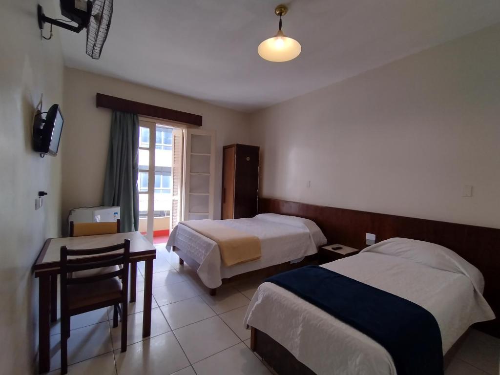 Кровать или кровати в номере Hotel Plaza Olido