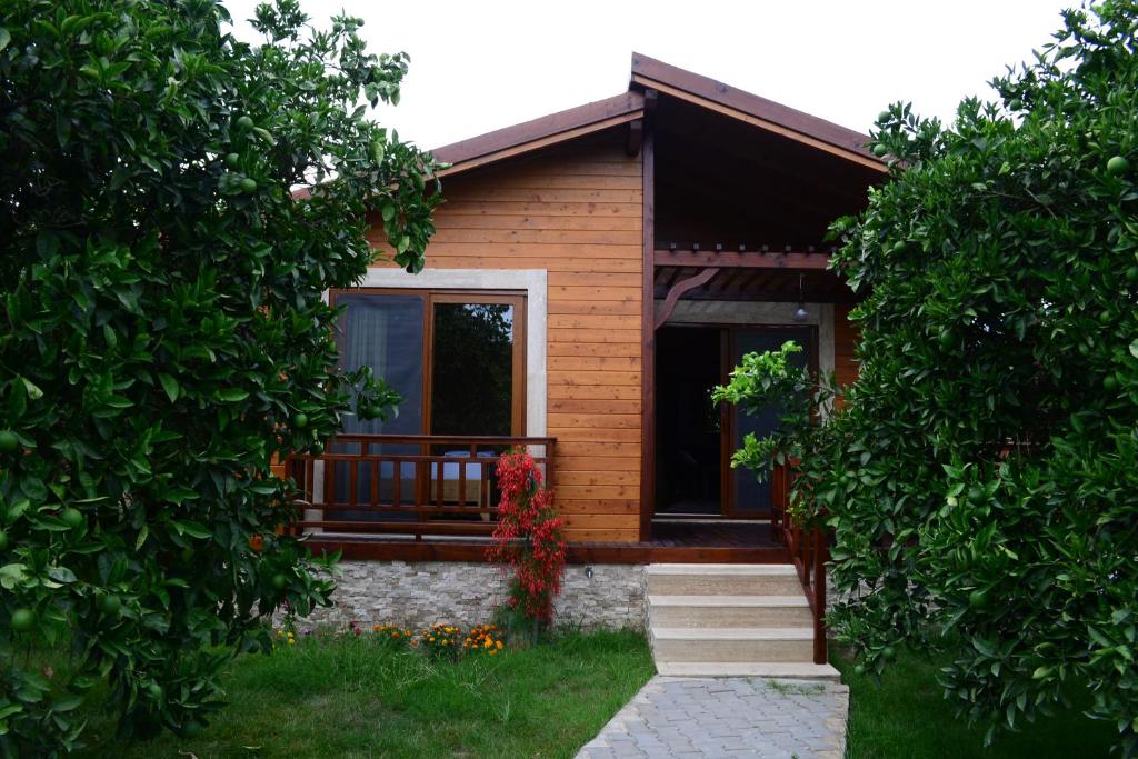 a house seen through the entrance to a yard at Villa Bilge in Cıralı