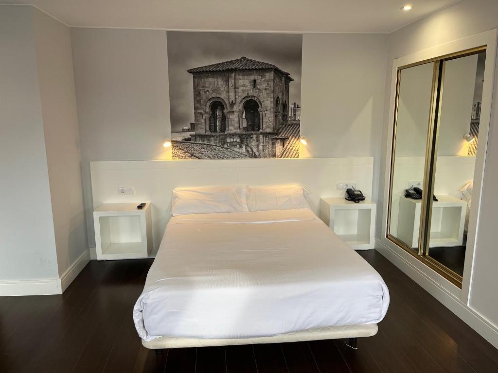 Postel nebo postele na pokoji v ubytování Hotel Gran Regente