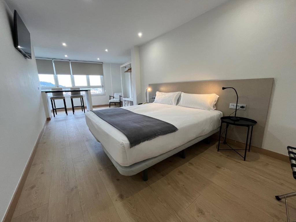 Postel nebo postele na pokoji v ubytování Hotel Gran Regente