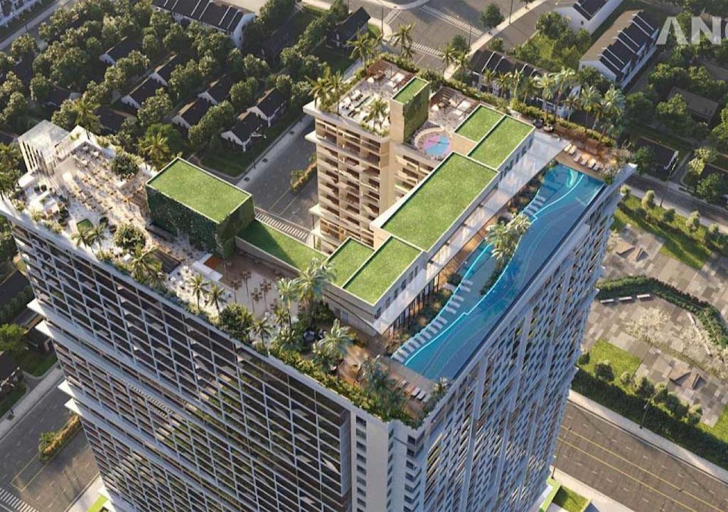 an overhead view of a large building with a green roof at The Song QA Apartment in Vung Tau