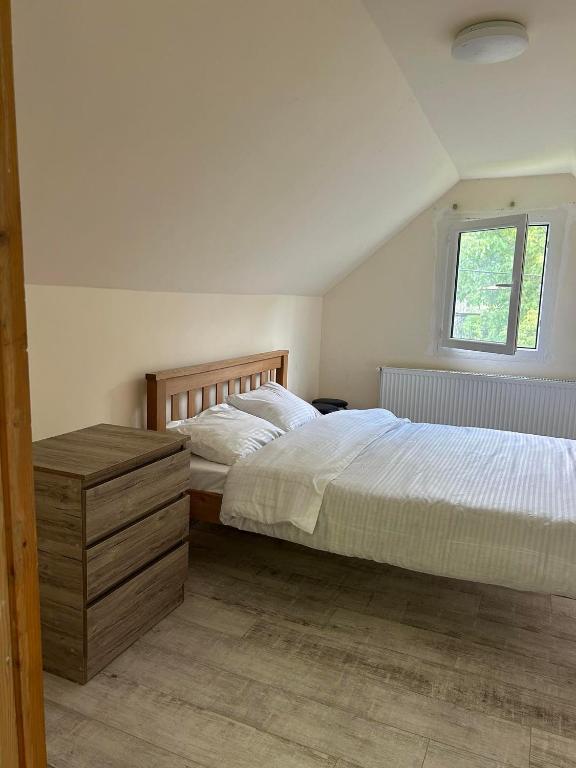 a bedroom with two beds and a window at Mia House in Borjomi